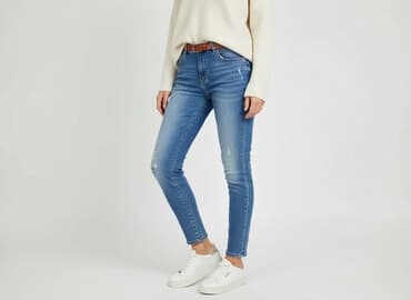 dziurawe dżinsy: Jeansy damskie, rozmiar L — 1