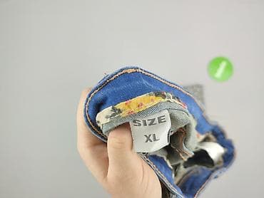 dziurawe dżinsy: Jeansy damskie, rozmiar XL — 4