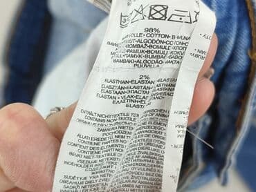 dziurawe dżinsy: Jeansy damskie, rozmiar S — 4