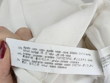 biale buty skarpetkowe: Jeansy damskie, rozmiar M — 5