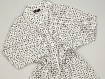 skladanie koszulki: Koszula damska, rozmiar XL — 1