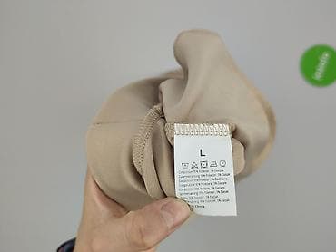 kieszenie cargo: Spodnie 3/4 damskie, rozmiar L — 4