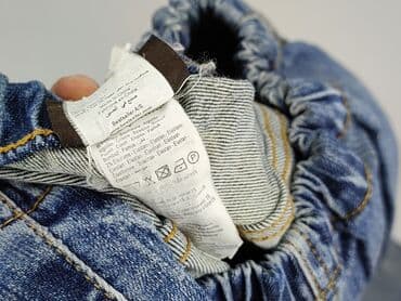 dziurawe dżinsy: Jeansy damskie, rozmiar L — 10