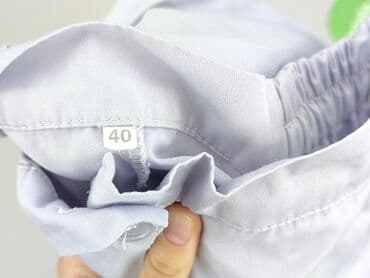 biale szerokie jeansy: Spodnie materiałowe damskie, rozmiar L — 4