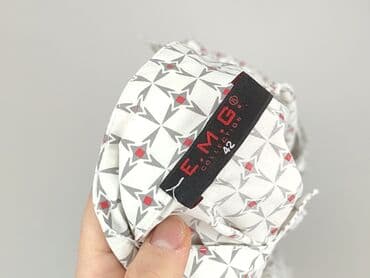 skladanie koszulki: Koszula damska, rozmiar XL — 4