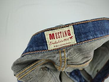 biale trampki mustang: Jeansy damskie, rozmiar M — 4