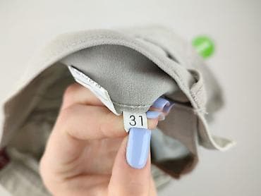 biale jeansy: Spodnie materiałowe damskie, rozmiar L — 4