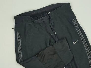 spodnie czarne tech fleece: Nike, Spodnie 3/4 damskie, rozmiar S — 1