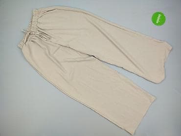 szerokie spodnie materialowe: Damskie szerokie spodnie w kolorze beżowym - Krój: luźny, proste — 2