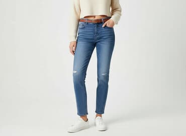 dziurawe dżinsy: Jeansy damskie, rozmiar L — 1