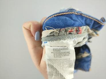 dziurawe dżinsy: Jeansy damskie, rozmiar XL — 5