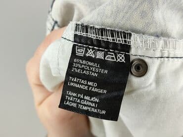 spodnie w łaty krowy: Spodnie materiałowe damskie, rozmiar L — 5